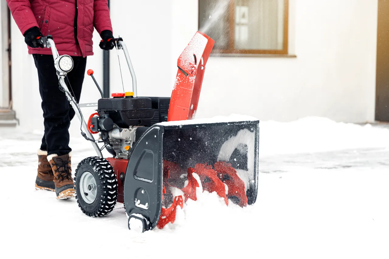 Snow blower clearing driveway in New Jersey